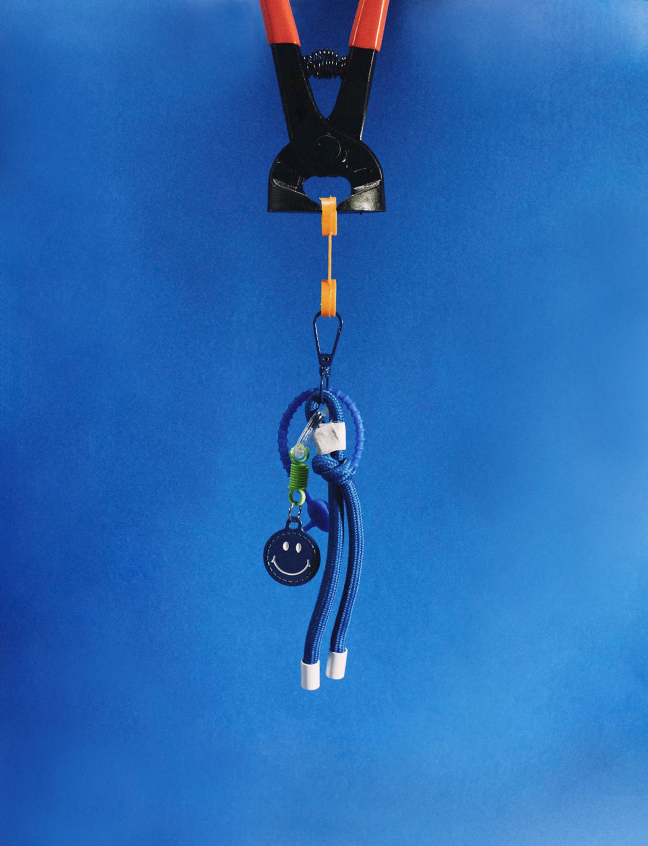 A small assembled object against a bright blue background
