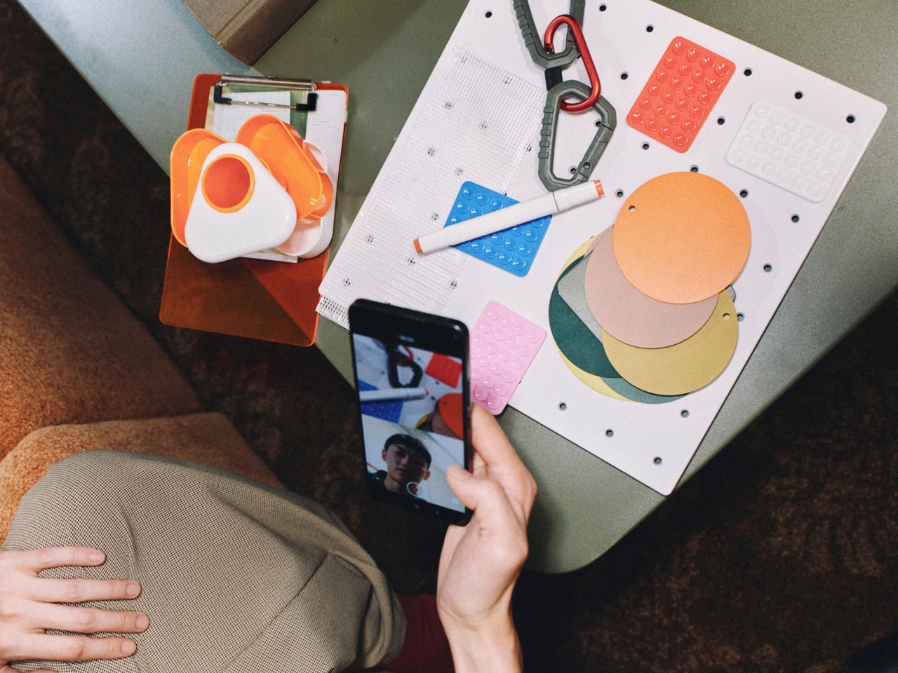 A person sharing a colorful workbench over a video call