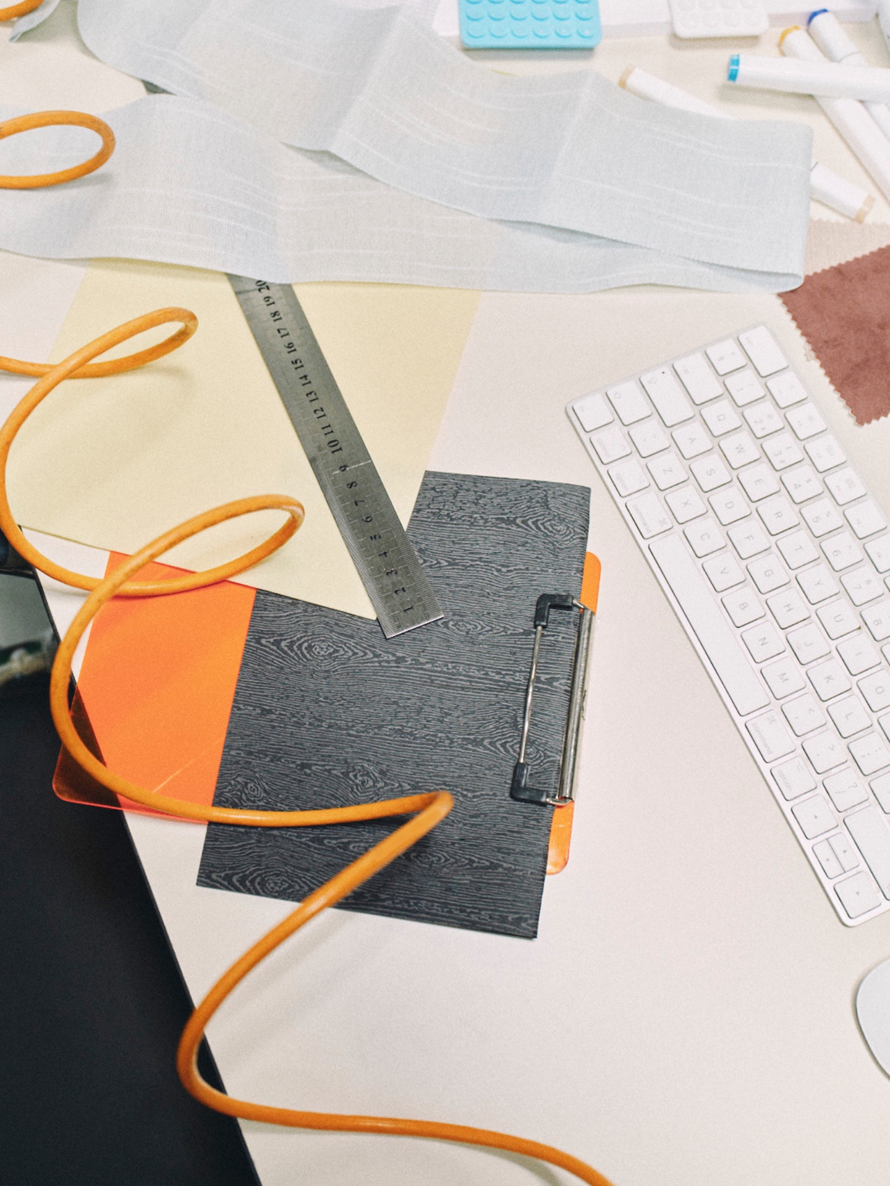 A workbench with tools and bright orange cable